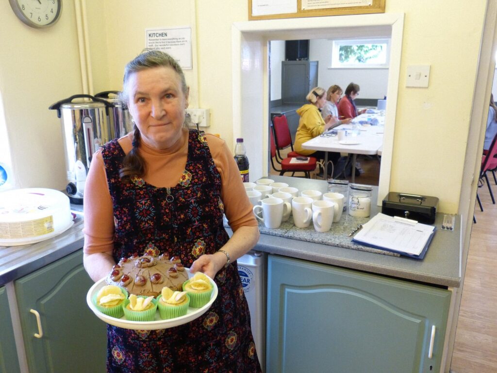 Alma with a plate of her famous cakes